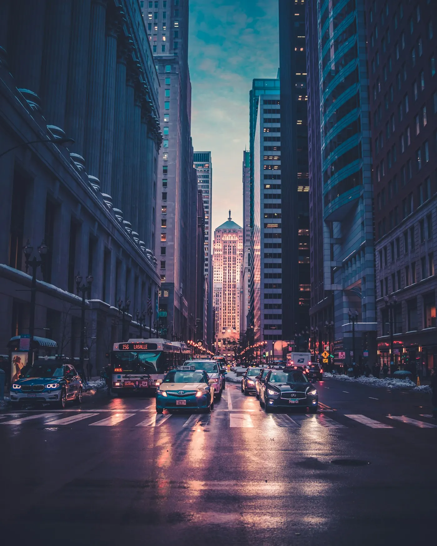 City buildings and a busy street illuminated at dusk